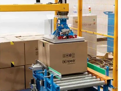 The column palletizer is stacking cartons The column palletizer is stacking cartons