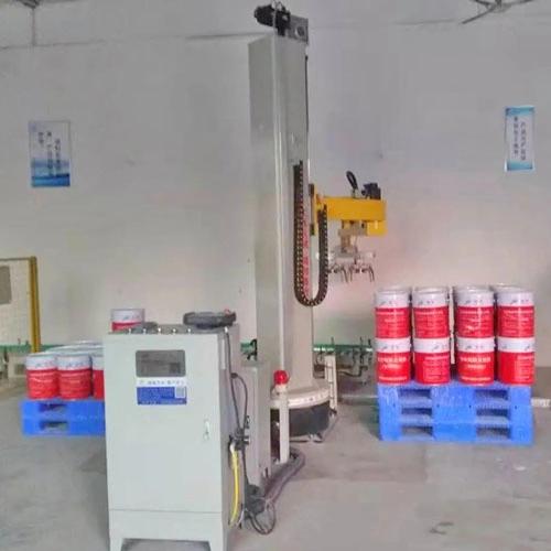The column palletizer is stacking drums The column palletizer is stacking drums